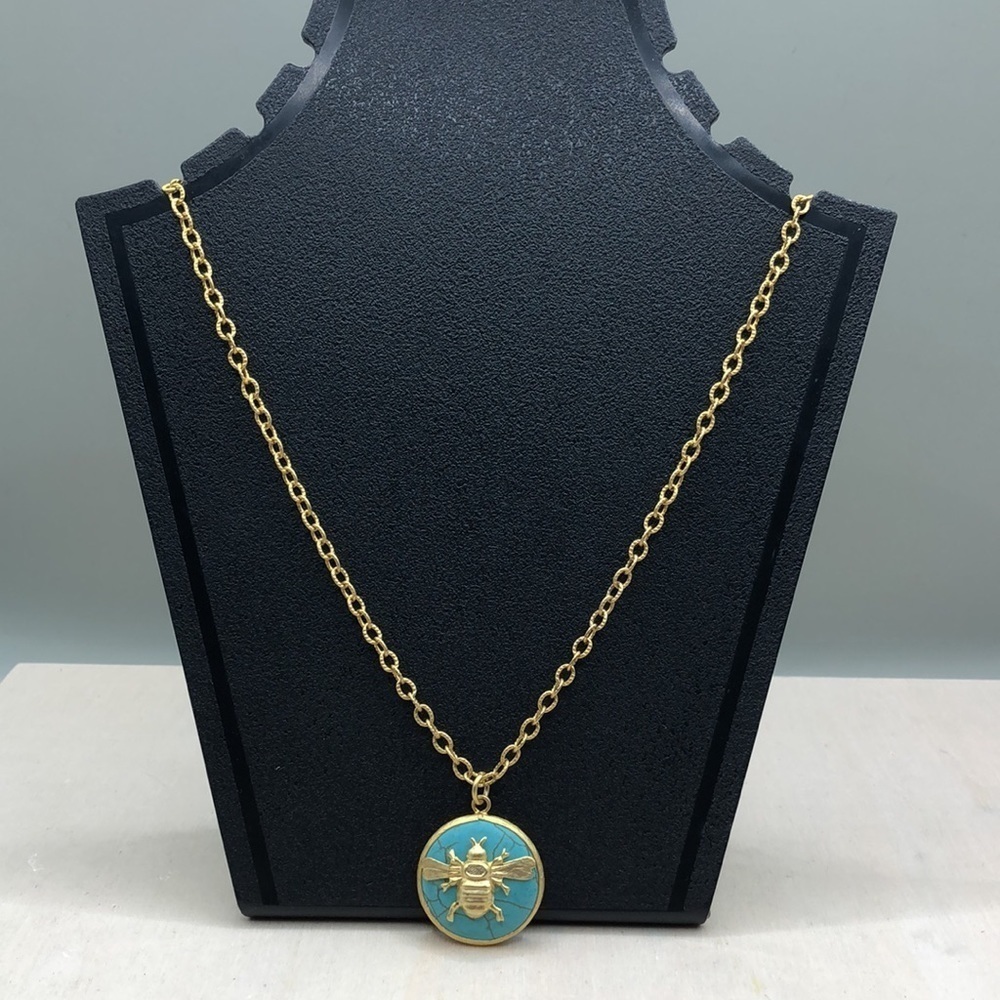 Gold tone chain necklace turquoise honey bee pendant.